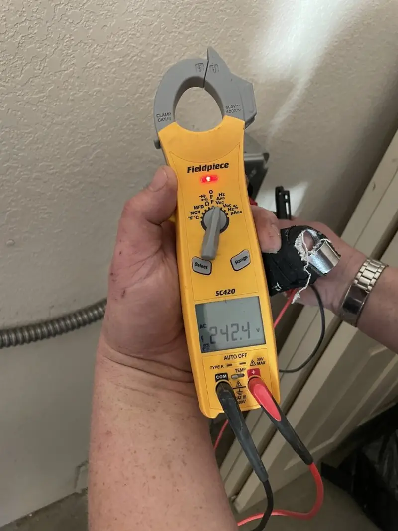 Voltage testing with clamp meter during Recessed Lighting Installation in Hardin